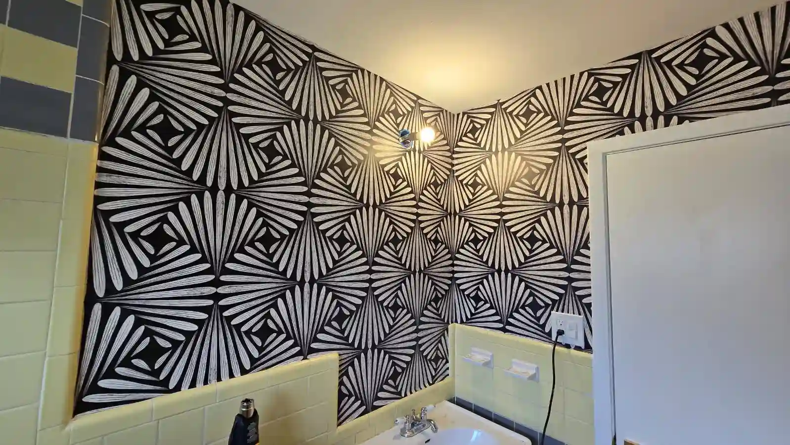 A repeating geometric wallcovering extending across an interior wall